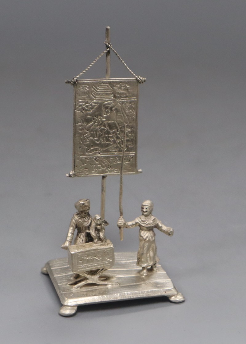 A Dutch white metal miniature figural group, height 11.2cm, 2 oz.